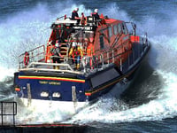 Tenby’s lifeboat crew assists paddleboarders in difficulty