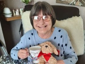 Lamphey mum receiving pamper hamper prize