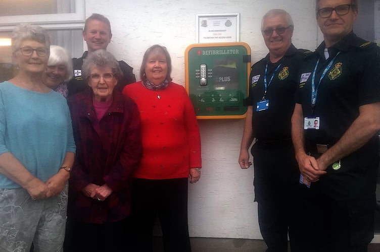 Presentation by Kilgetty WI of a defibrillator to the community.