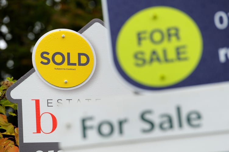 DO NOT REUSE - NO PERMISSION FOR REUSE
File photo dated 14/10/14 of a sold and for sale signs. A gradual slowdown in the housing market in Scotland is likely as the cost-of-living crisis bites, a report has warned. House prices in Scotland continue to edge upwards but indicators are softening slightly, according to the Royal Institution of Chartered Surveyors (Rics) latest survey. Issue date: Thursday May 12, 2022.