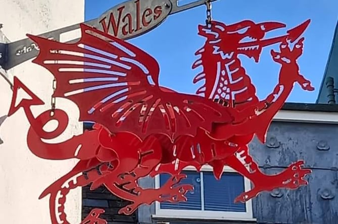 Wales Drago metal sign in Tenby