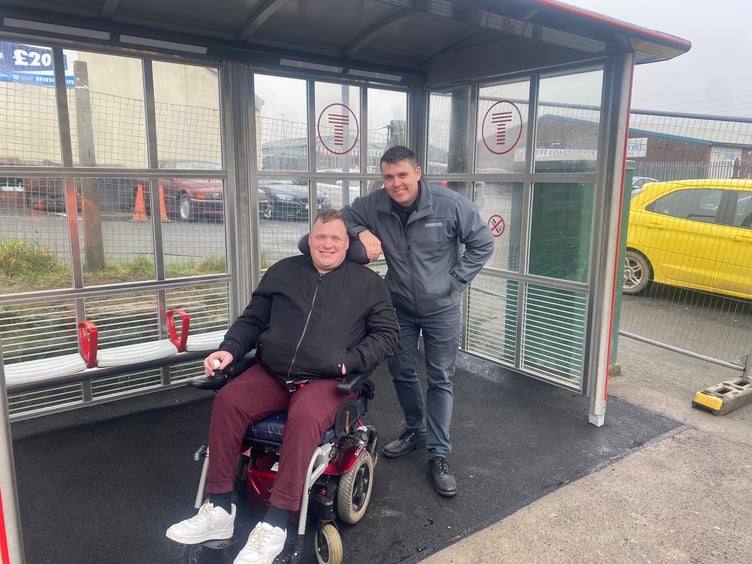 Passenger Matthew Marchant at Johnston station with station manager James Nicholas.