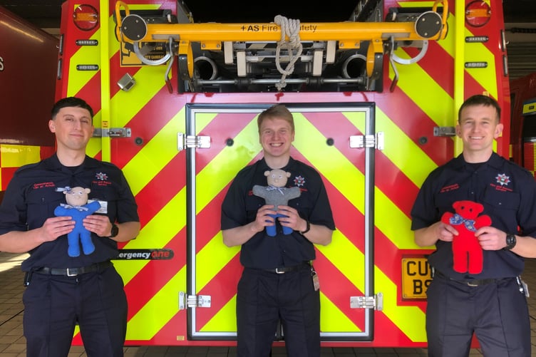 Firemen with trauma teddies
