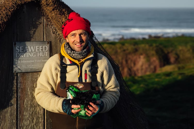 Jonathan Williams, founder of National Laverbread Day, pictured by the seaweed drying hut at Freshwater West, Pembrokeshire