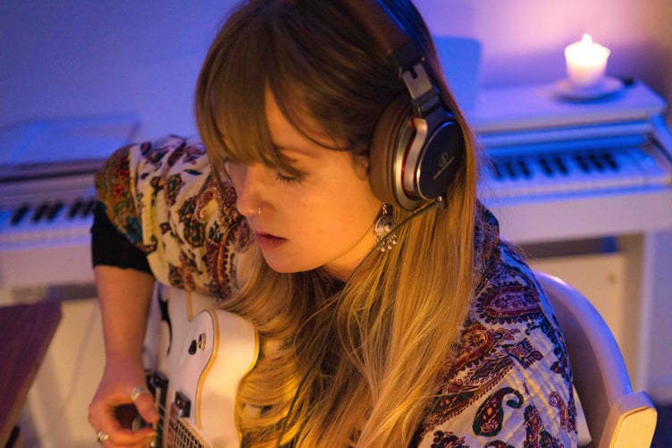 Pembrokeshire musician Jodie Marie recording in the cabin on Seiland
