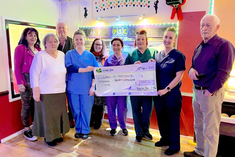 Pictured from left to right: Vanessa Ircha, Cath IrchaÕs Sister; Judy Wickland, CathÕs Mum; Tony Griffiths, Club Manager; Ffion Thomas, Registered Nurse; Tracy Horobin, Nurse; Lynsey Mason, HCSW and Student Nurse; Eve Owen, HCSW; Rebecca Jones, Junior Sister and Dave Owen, Club Chairman.