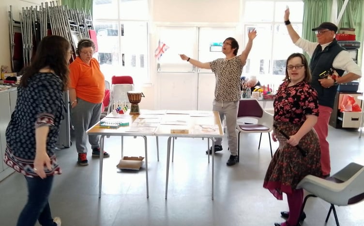 Tenby Project members enjoying music with Jim Cornwell