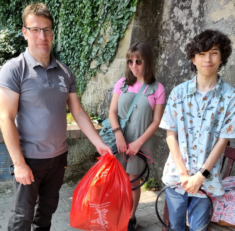 Litter picking group on the North Beach zig-zag in Tenby
