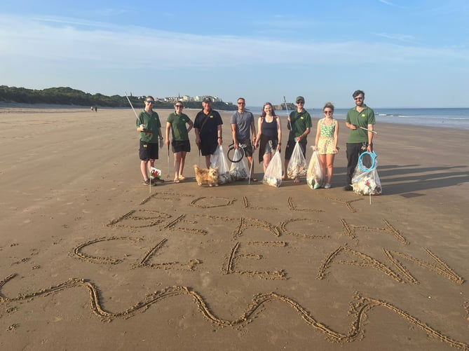 Folly Farm’s Pippa, Rosie, Alan (and Saffy the puppy), Rhys, Kim, Jack, Becky and Dan on Tenby’s South Beach with the plastic and litter they had collected