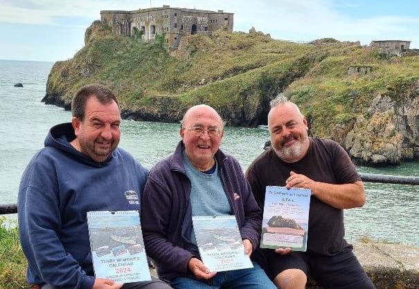 Albie Smosarski of Cofion Books is pictured, (centre) with Matthew Fry (left) and Andi Jones of St CatherineÕs Island and Fort with the Tenby Memories 2024 Calendar at the launch this week.