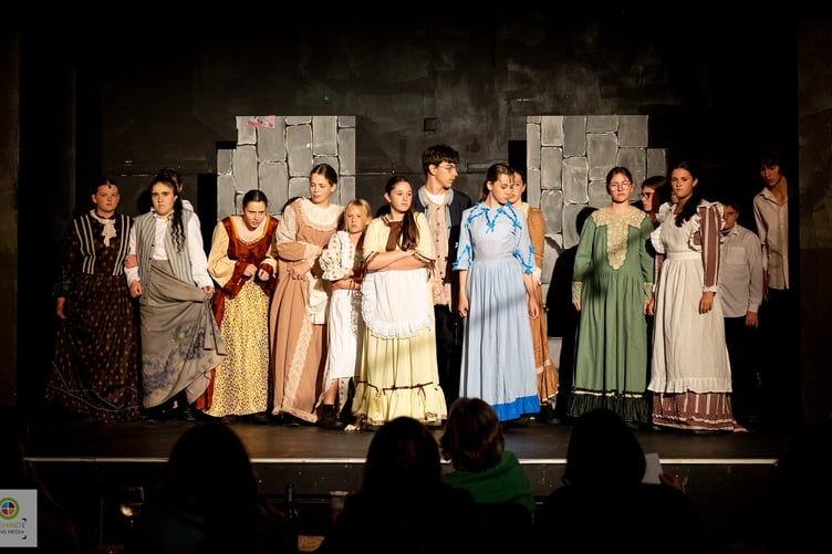 The ensemble performs At The End Of The Day