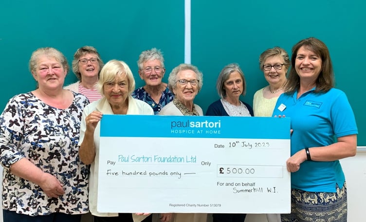 Summerhill WI ladies presenting a cheque for £500 to Paul Satori as a result of two recent bottle stalls.