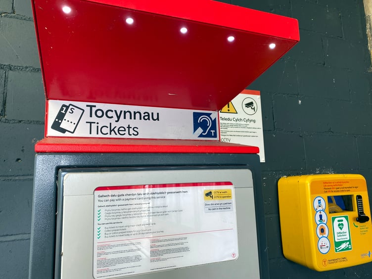 Ticket machine and defibrillator at Tenby Railway Station