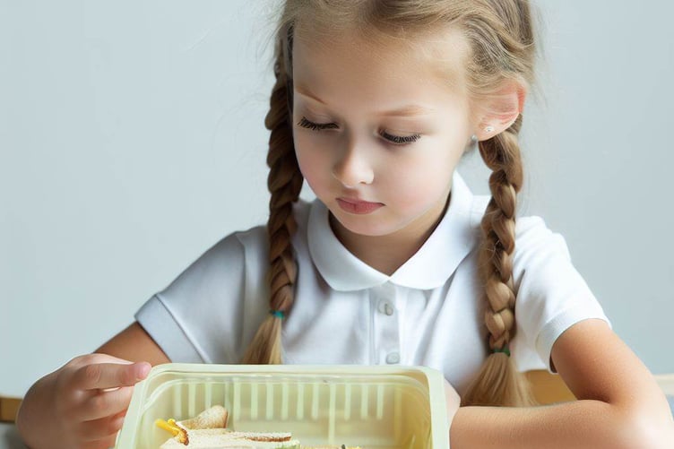 Child looking into nearly empty lunchbox