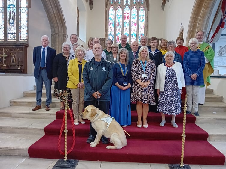With Rector Reverend Canon Andrew Grace are representatives of some of the many organisations and charities in receipt of donations from St MaryÕs Church, Tenby funded by proceeds from the townÕs Seaview car park, which is church property.