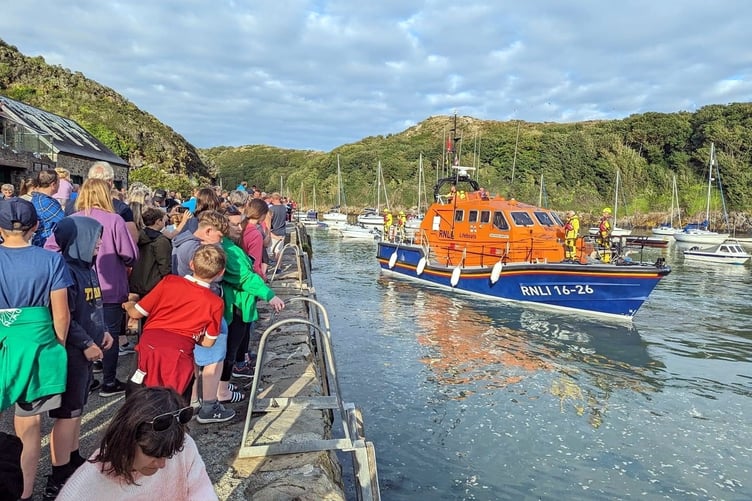 The arrival of St Davids RNLI lifeboat Norah Wortley at Solva.