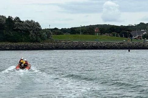 Angle RNLI Y boat crew found the casualty frightened and cold, waist deep in water and stuck firmly in the mud at Pembroke Dock.