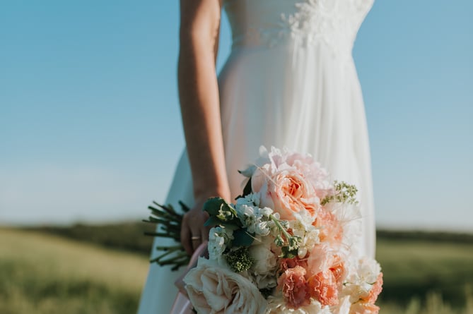 Slim bride with bouquet