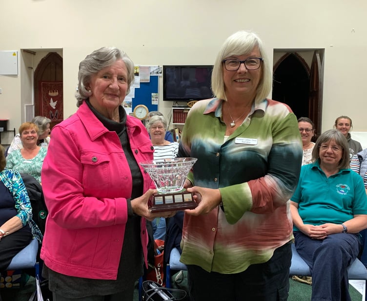 Chair Sandra Western receiving the Waterford crystal rosebowl from outgoing Chair Trisha Campodonic. This unique rosebowl was presented to the choir at the Waterford Crystal factory in Ireland whilst on tour in Ireland to celebrate the choirÕs 20th Anniversary in 1997.