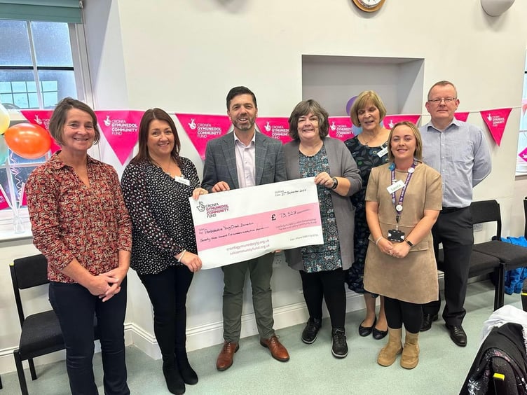 Stephen Crabb MP presenting the cheque at the Day service Launch on Wednesday, September 27. Pictured are Cllr Di Clements; trustee Jane Smith; Stephen Crabb MP; trustee Gill Leese; Laura Long Ð Share the Care; trustee Cherry Evans and David Howlett, representing Paul Davies AM.