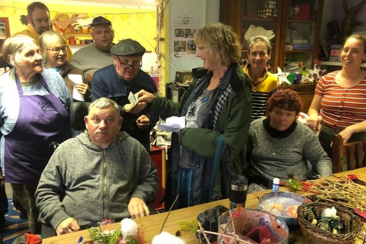 Pembroke Soup’s Joan Marsh visiting Esteam with the donation