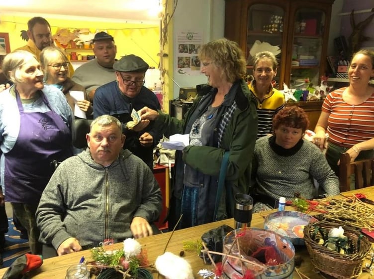 Pembroke Soup’s Joan Marsh visiting Esteam with the donation