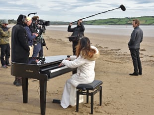 Rhod Gilbert chooses Llansteffan Beach for Stand Up To Cancer filming