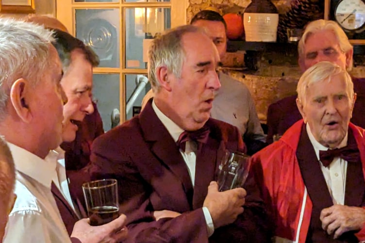 Duncan Hilling (97) leads singing of Fields-of-Athenry