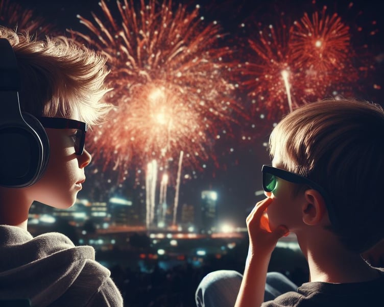 Children wearing sunglasses and headphones watching fireworks