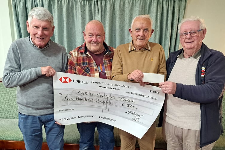 Club Vice Chairman Dave Esmond presenting a cheque for £500 to Martin Hyde, Carl Lawton and Keith Hamer of Carew Control Tower