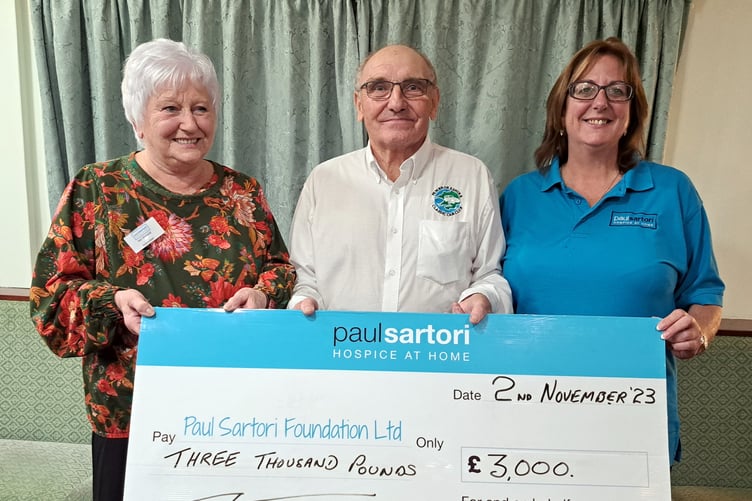 Club Secretary Peter Badham presenting Sandra Dade and Val Harrold of Paul Sartori