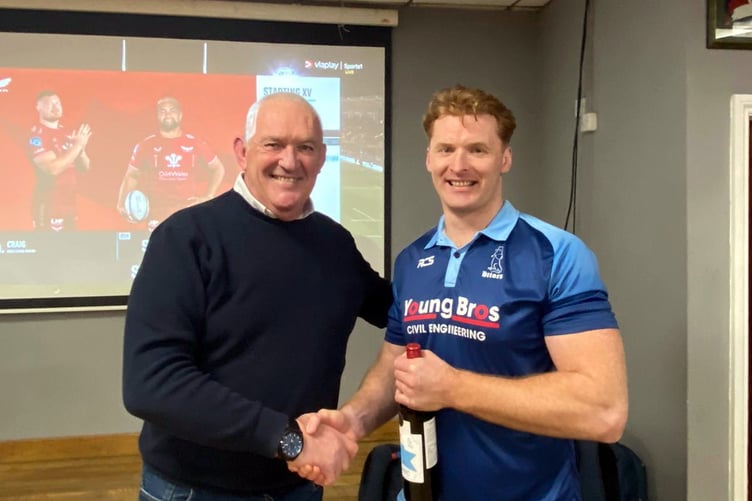 Match sponsors Kevin Lane & Co, Solicitors presenting Roy Osborn with Man of Match Award.