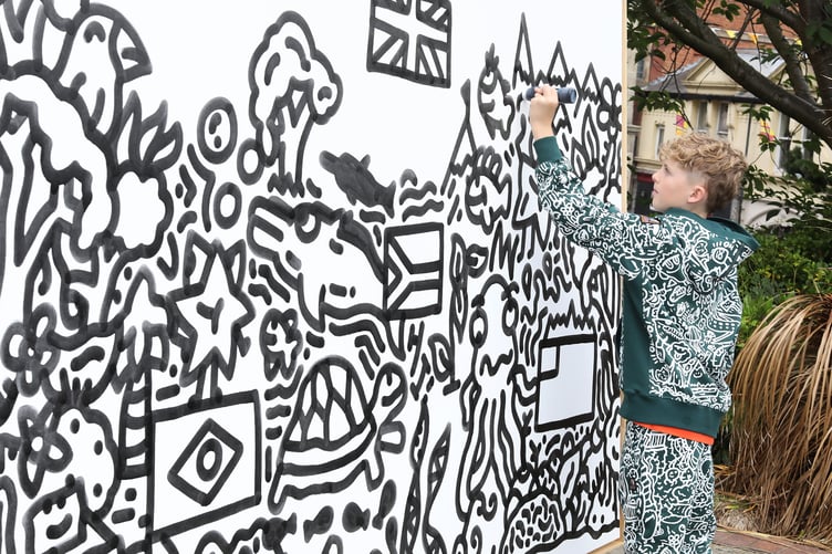 Joe Whale aka The Doodle Boy at Shrewsbury Town Library working on his masterpiece.