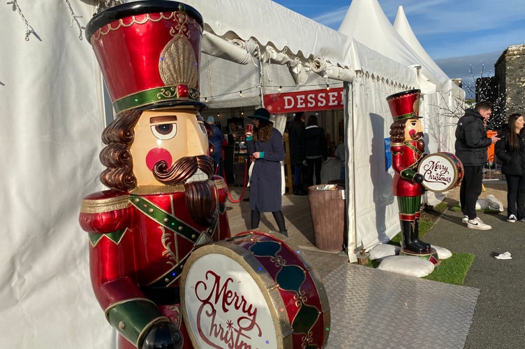 Nutcrackers at entrance to Pembroke Castle Christmas Market marquee