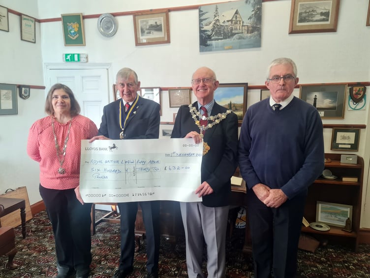 Mayor of Pembroke Cllr Aden Brinn presenting the donation to Royal British Legion District Chairman Mr Tom Brown. Also in the photo is the Mayoress Mrs Claire Dunfresnoy and Royal British Legion District Treasurer Mr John Mycroft.