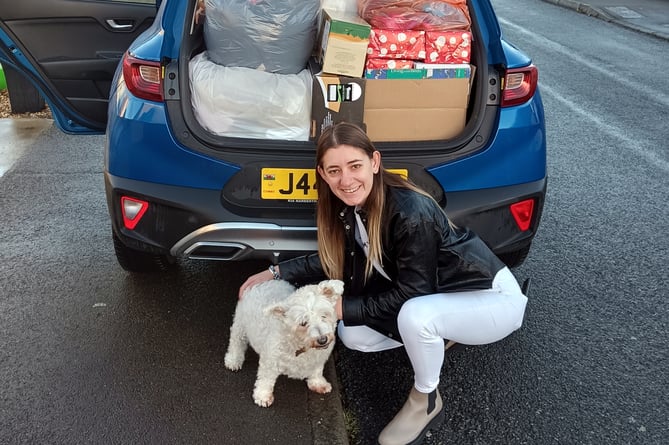 Bethan Osborne with the car loaded with donations ready for the Cardiff trip