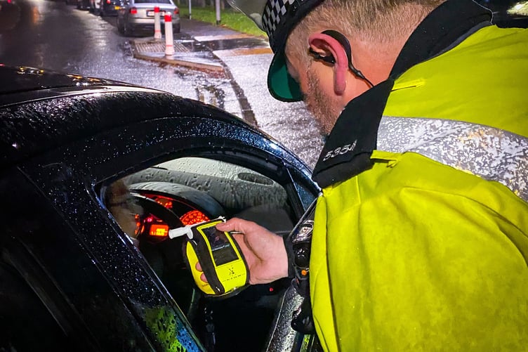 Police conducting a roadside breath test.