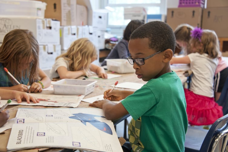 Young children partaking in school class activity