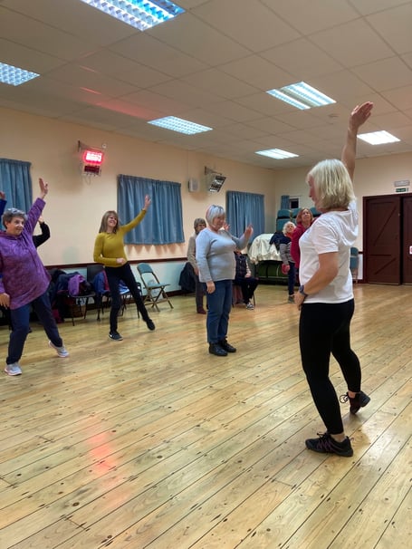 Members of Cosheston WI trying out Fit Steps with Helen John.