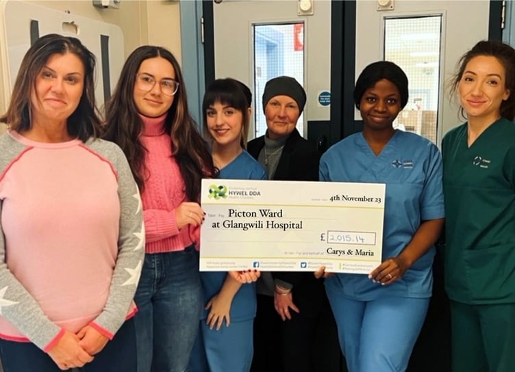 Carys and Maria cheque presentation for Glangwili Hospital