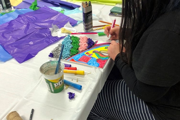 A member of Hywel Dda staff enjoying creative activities