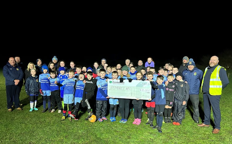 Cheque being handed to Pembrey AFC