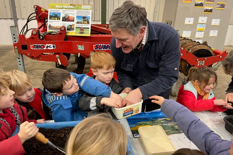 Ysgol Bro Ingli year 2 pupils getting hands on with arable farmer Walter Simon