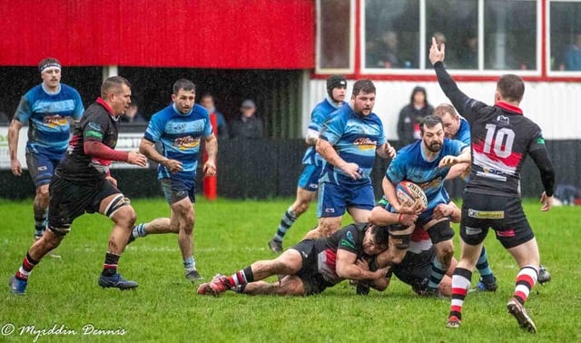 Richard Rees driving forward with the ball.