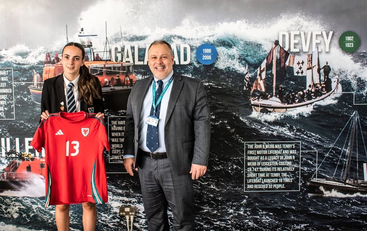 Greenhill School has hailed the latest achievement of Sixth Form student Imogen Scourfield who has just returned from a Wales U19s football camp in Moldova. 
Imi was part of a squad that played three international matches during the ten day camp. “Incredible achievement Imi - you are an inspiration to us all,” said headteacher David Haynes, who is pictured alongside.