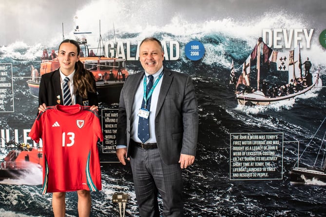 Greenhill School has hailed the latest achievement of Sixth Form student Imogen Scourfield who has just returned from a Wales U19s football camp in Moldova. 
Imi was part of a squad that played three international matches during the ten day camp. “Incredible achievement Imi - you are an inspiration to us all,” said headteacher David Haynes, who is pictured alongside.