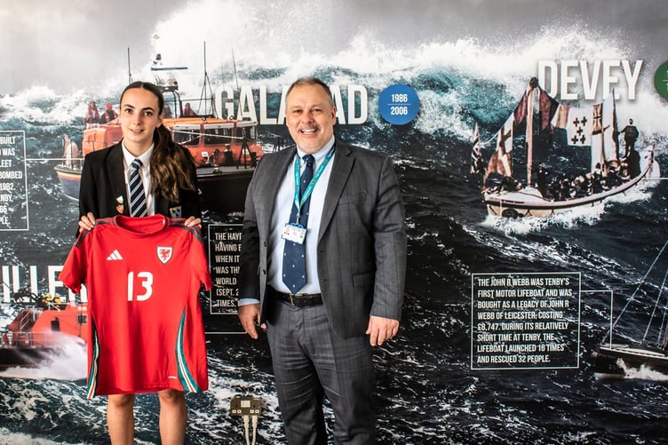 Greenhill School has hailed the latest achievement of Sixth Form student Imogen Scourfield who has just returned from a Wales U19s football camp in Moldova.
Imi was part of a squad that played three international matches during the ten day camp. “Incredible achievement Imi - you are an inspiration to us all,” said headteacher David Haynes, who is pictured alongside.