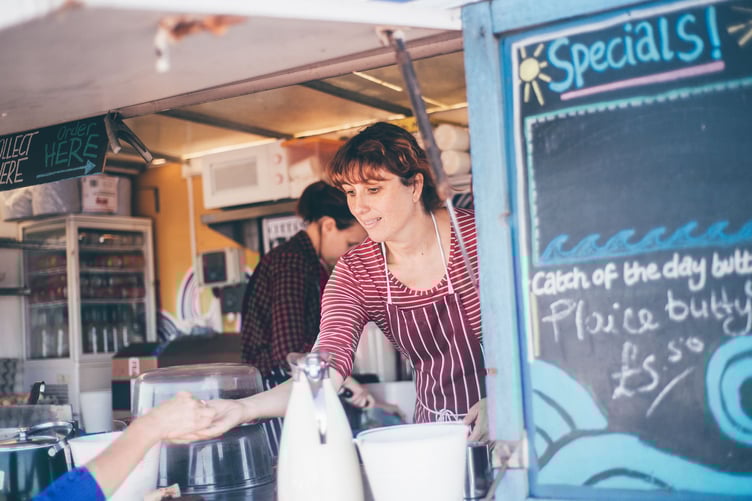 Food being served from kiosk at festival or event