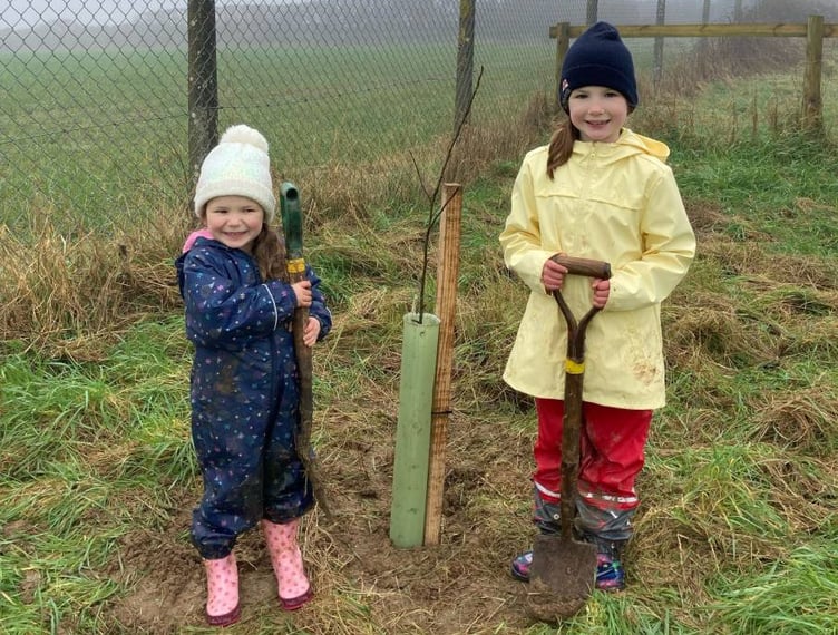 Nolton and Roch Community Planting Day: Two young volunteers from the village who helped plant the four St Bride’s Apple trees as well as 70 hedgerow whips.