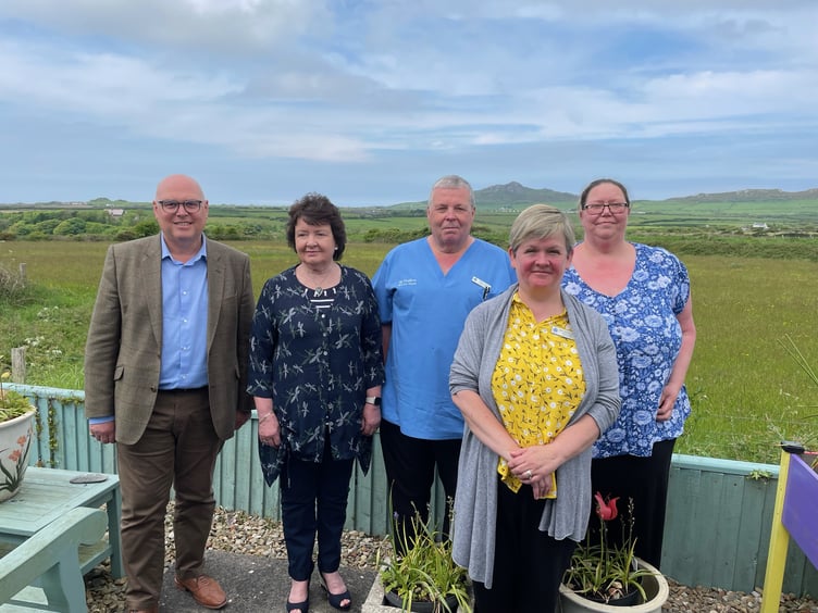 Paul Davies MS is pictured with representatives from Shalom House.